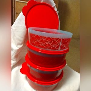 Four Tupperware brand containers with seals